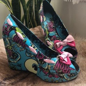 Iron fist peep toe eyes and brains wedges